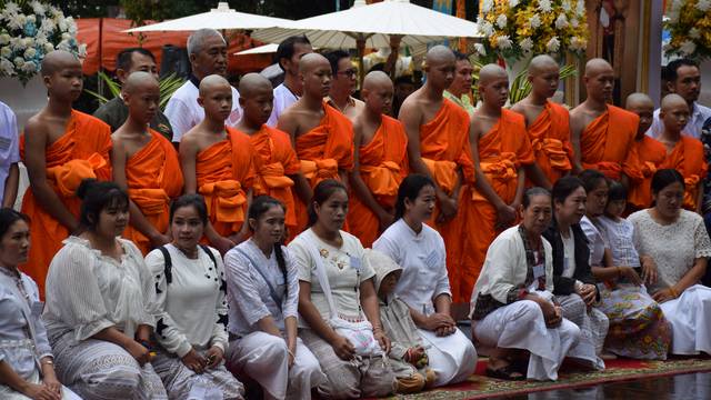 Members of the soccer team rescued from a cave attend a Buddhist ordination ceremony at a temple at Mae Sai