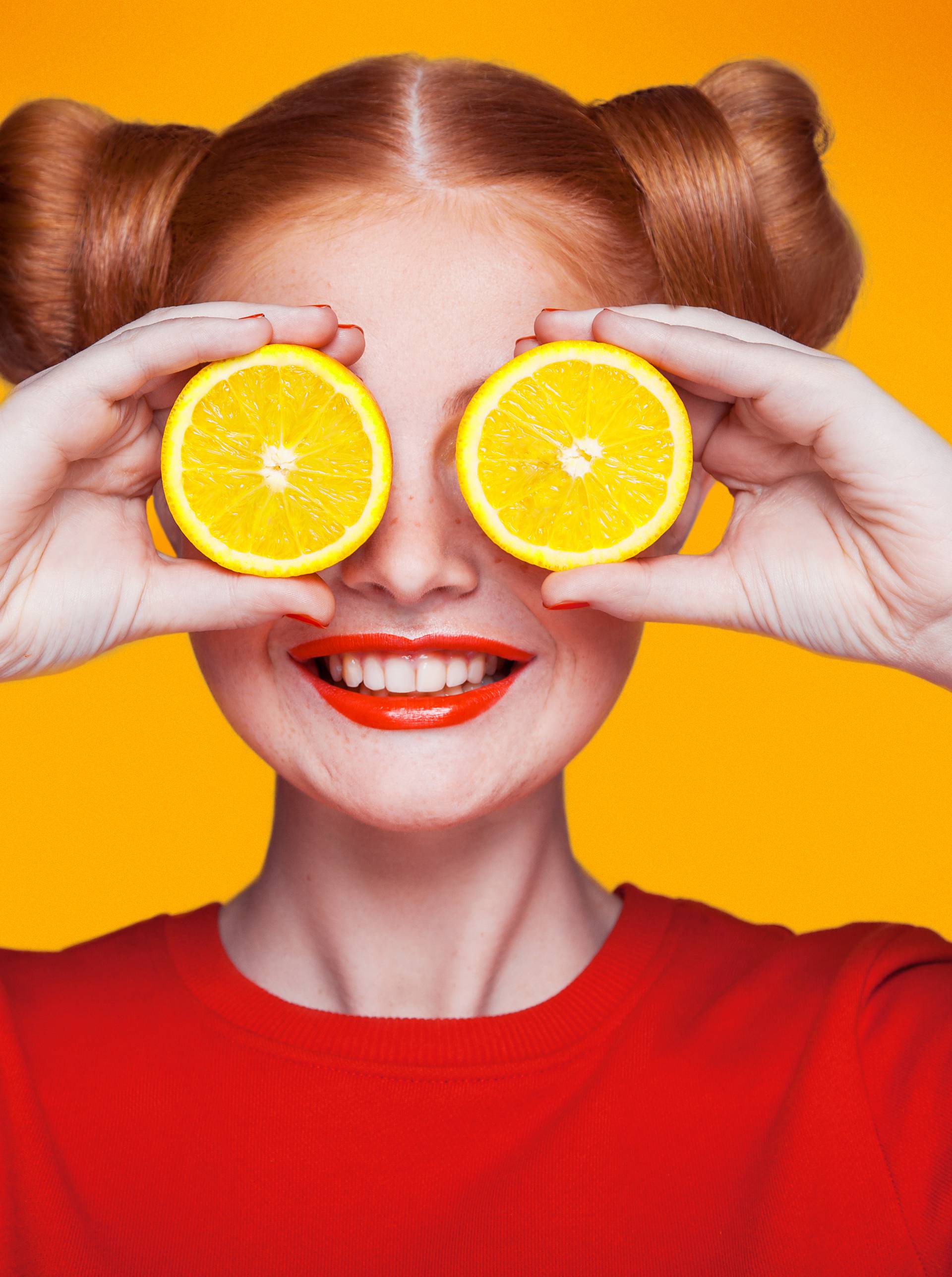 Young beautiful fashion model with Lemon. studio shot.