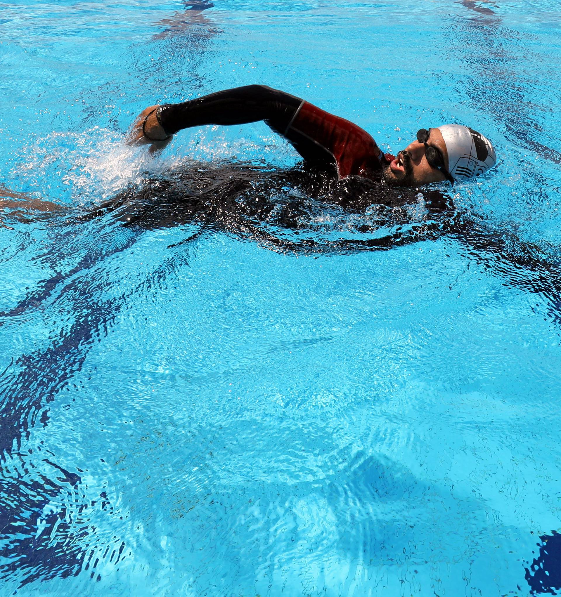 Egyptian swimmer Omar Hegazy, who is the first one-legged man to swim across the Gulf of Aqaba from Egypt to Jordan, during practice in Cairo