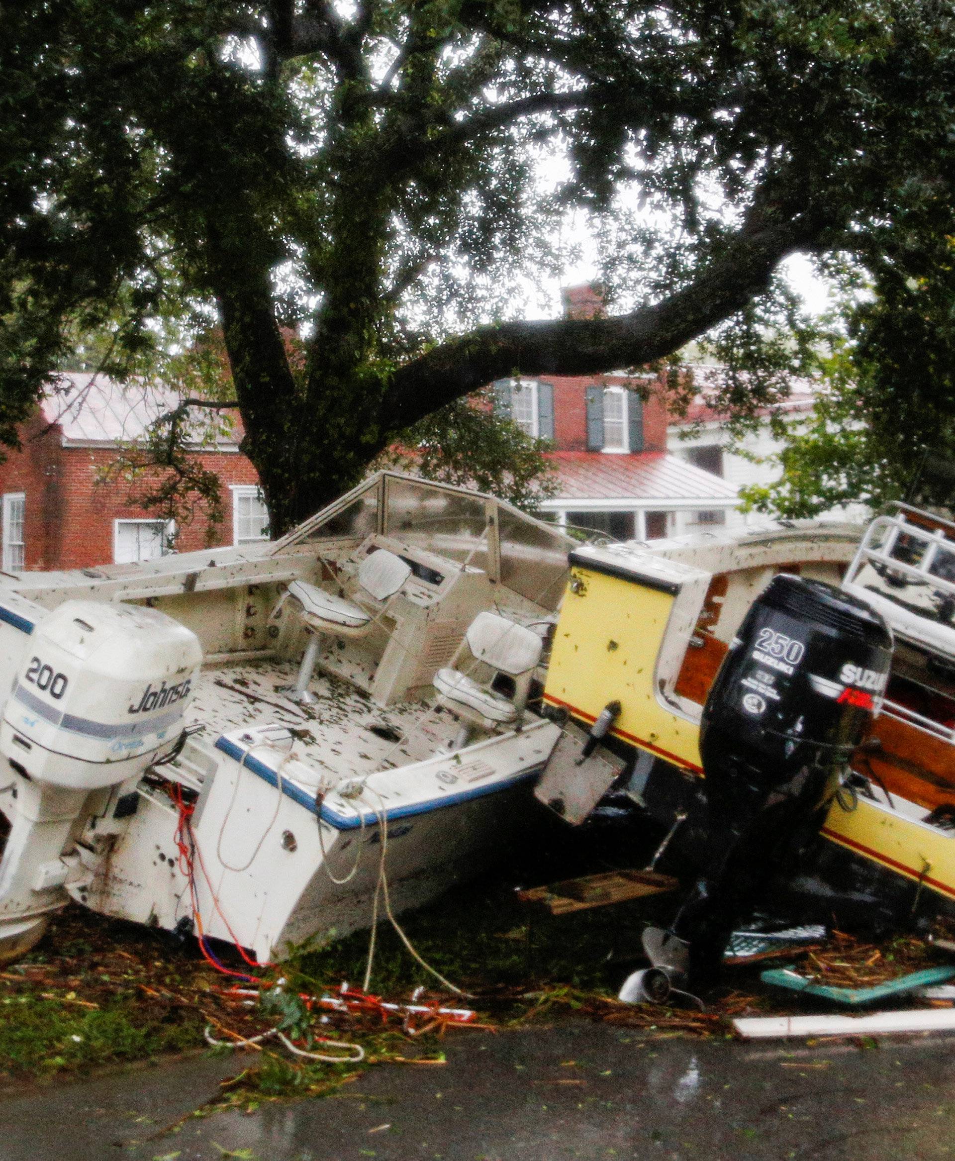 Boats pushed away from the dock are seen on a street during the passing of Hurricane Florence in the town of New Bern