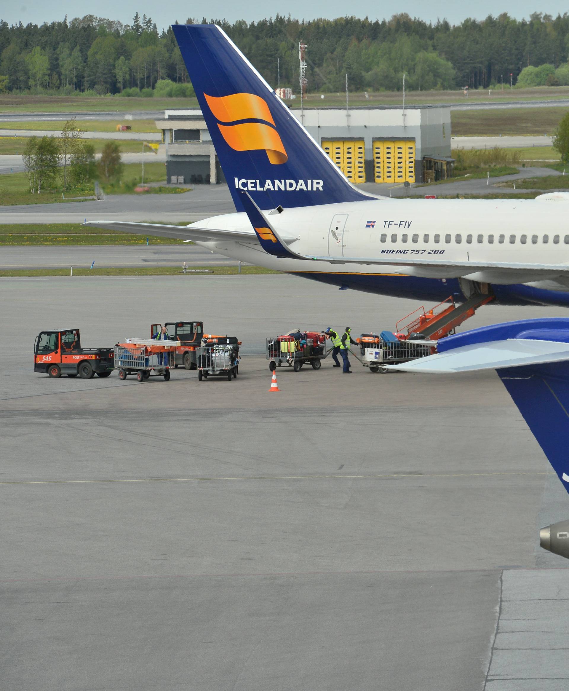 SAS planes and an Icelandair plane are parked as they wait to be able to leave from Arlanda airport Stockholm