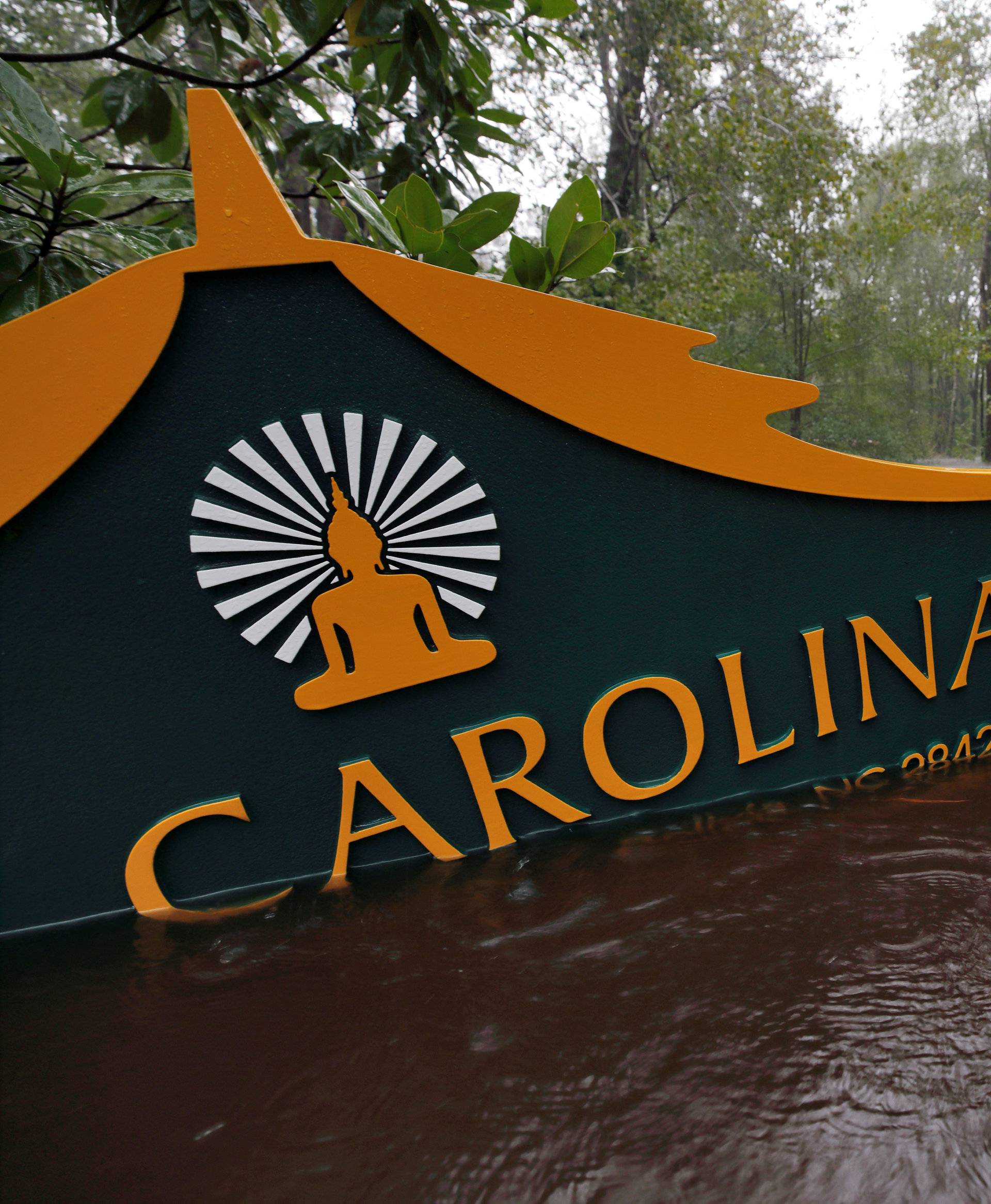 A sign for the Buddhist Association of North Carolina is partially submerged as waters rise after Hurricane Florence swept through in North Carolina
