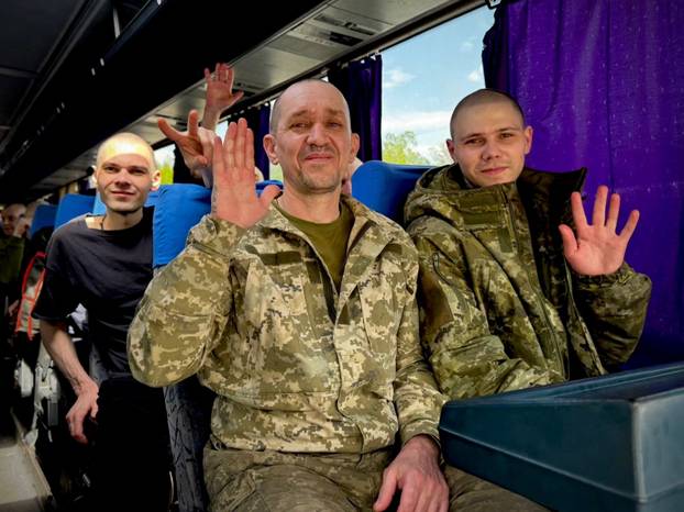 Ukrainian POWs are seen after a swap at an unknown location in Ukraine