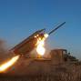 Ukrainian servicemen fire a Grad MLRS towards Russian troops near the frontline town of Pokrovsk