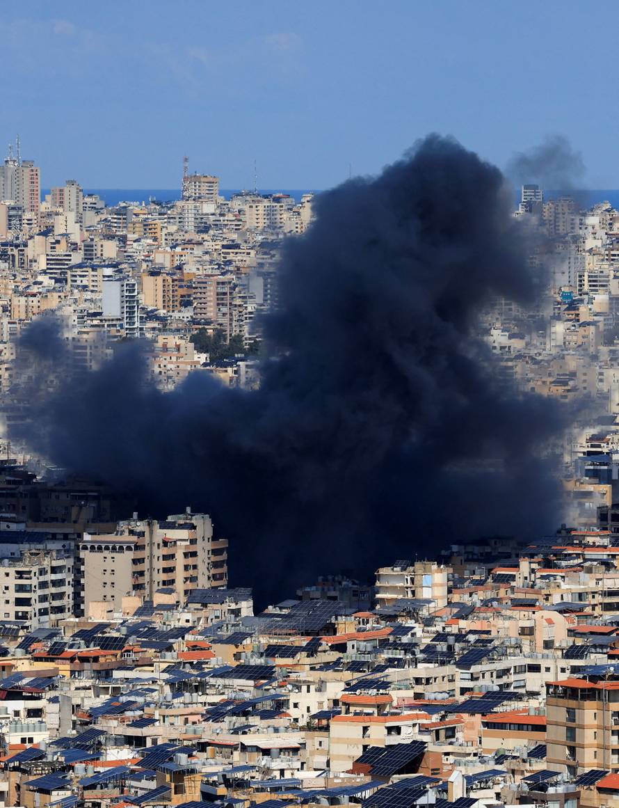 Smoke billows after an Israeli strike on Beirut's southern suburbs