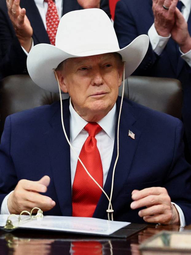 U.S. President Donald Trump signs a bill to award congressional gold medals to members of the 1980 U.S. Olympic men's hockey team, in Washington