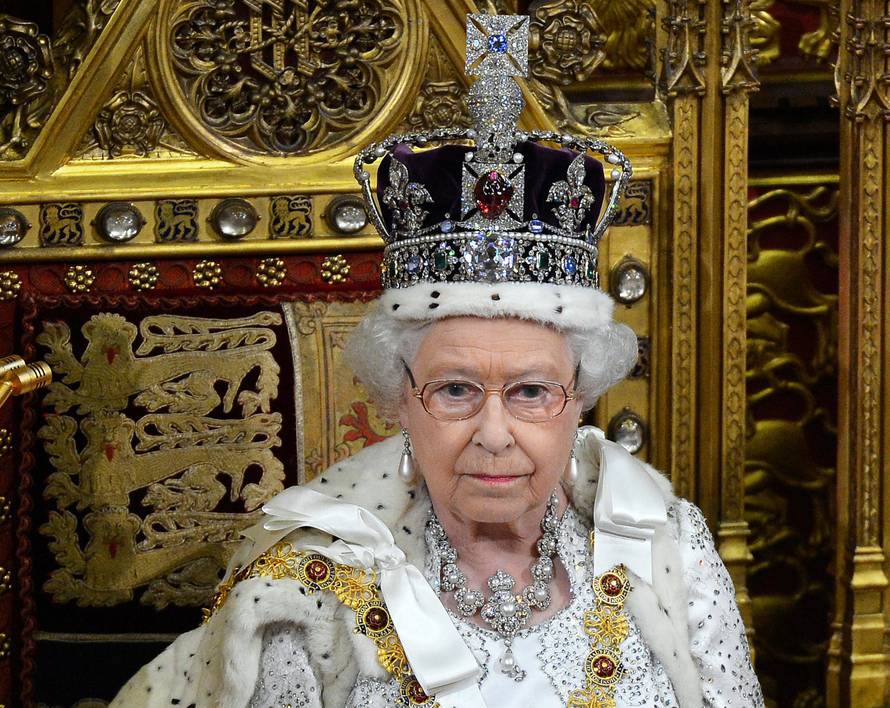 FILE PHOTO: Britain's Queen Elizabeth waits before delivering her speech in the House of Lords, during the State Opening of Parliament at the Palace of Westminster in London