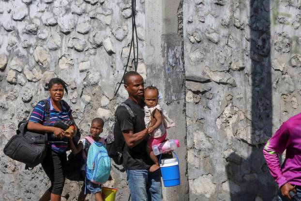 Haitians flee homes due to gang violence, in Port-au-Prince