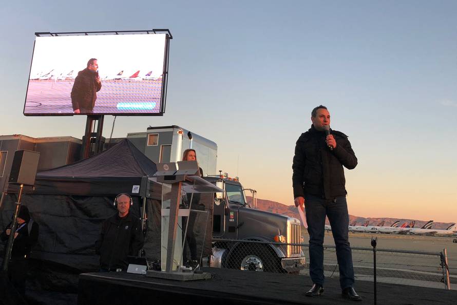 Palermo president of The Spaceship Company speaks to a crowd before the planned take off of virgin Galacticâs space tourism plane at Mojave Air and Space Port in Mojave