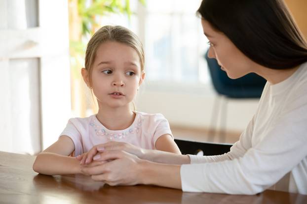 Head,Shot,Unhappy,Small,Child,Girl,Sitting,At,Table,With