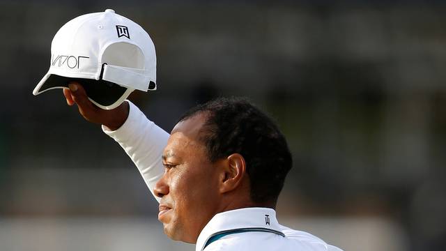 FILE PHOTO: Woods of the U.S. acknowledges the crowd as he walks off the 18th green during the second round of the British Open golf championship on the Old Course in St. Andrews, Scotland