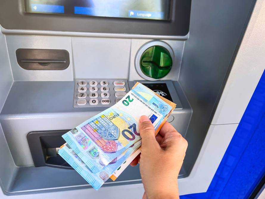 Withdrawing,Money,In,Euros,From,An,Atm
