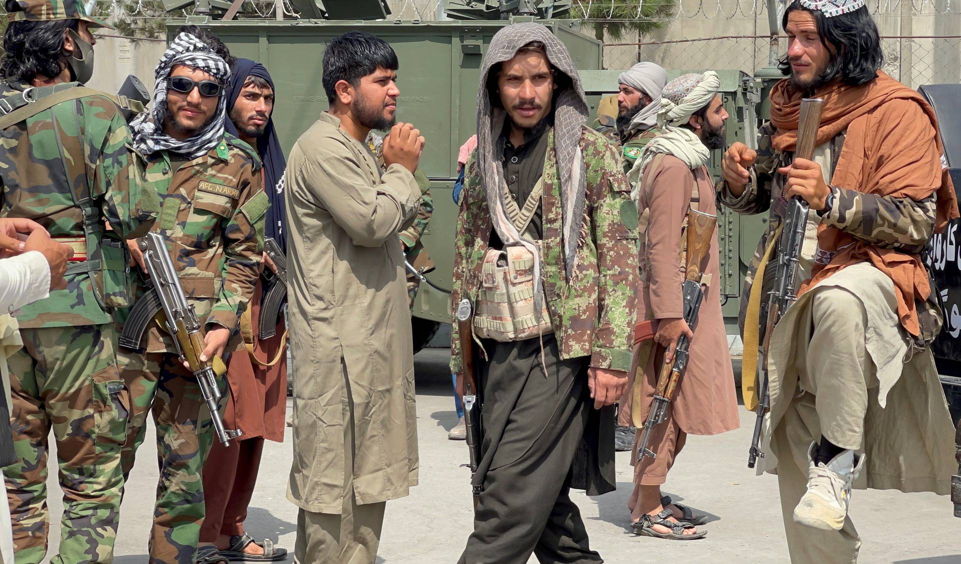 FILE PHOTO: Taliban forces patrol at a runway a day after U.S troops withdrawal from Hamid Karzai International Airport in Kabul