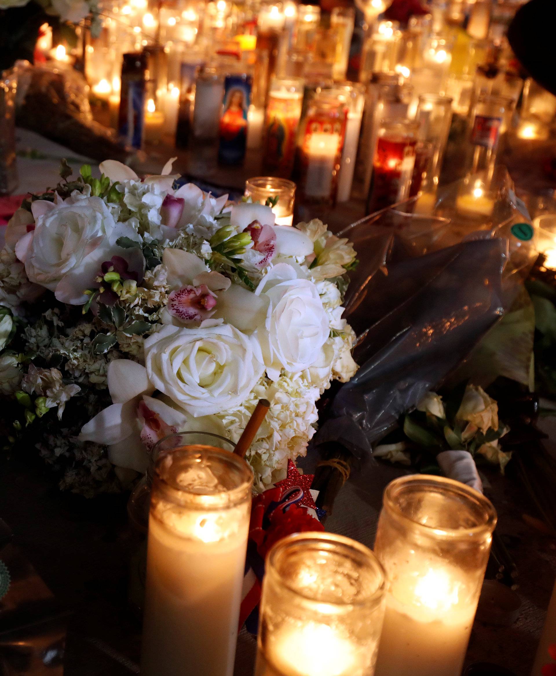 Flowers are shown at a makeshift memorial for shooting victims at the Las Vegas Strip and Sahara Avenue in Las Vegas