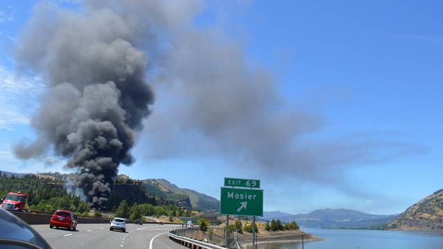 Handout photo of smoke billowing from a derailed oil train near Mosier, Oregon