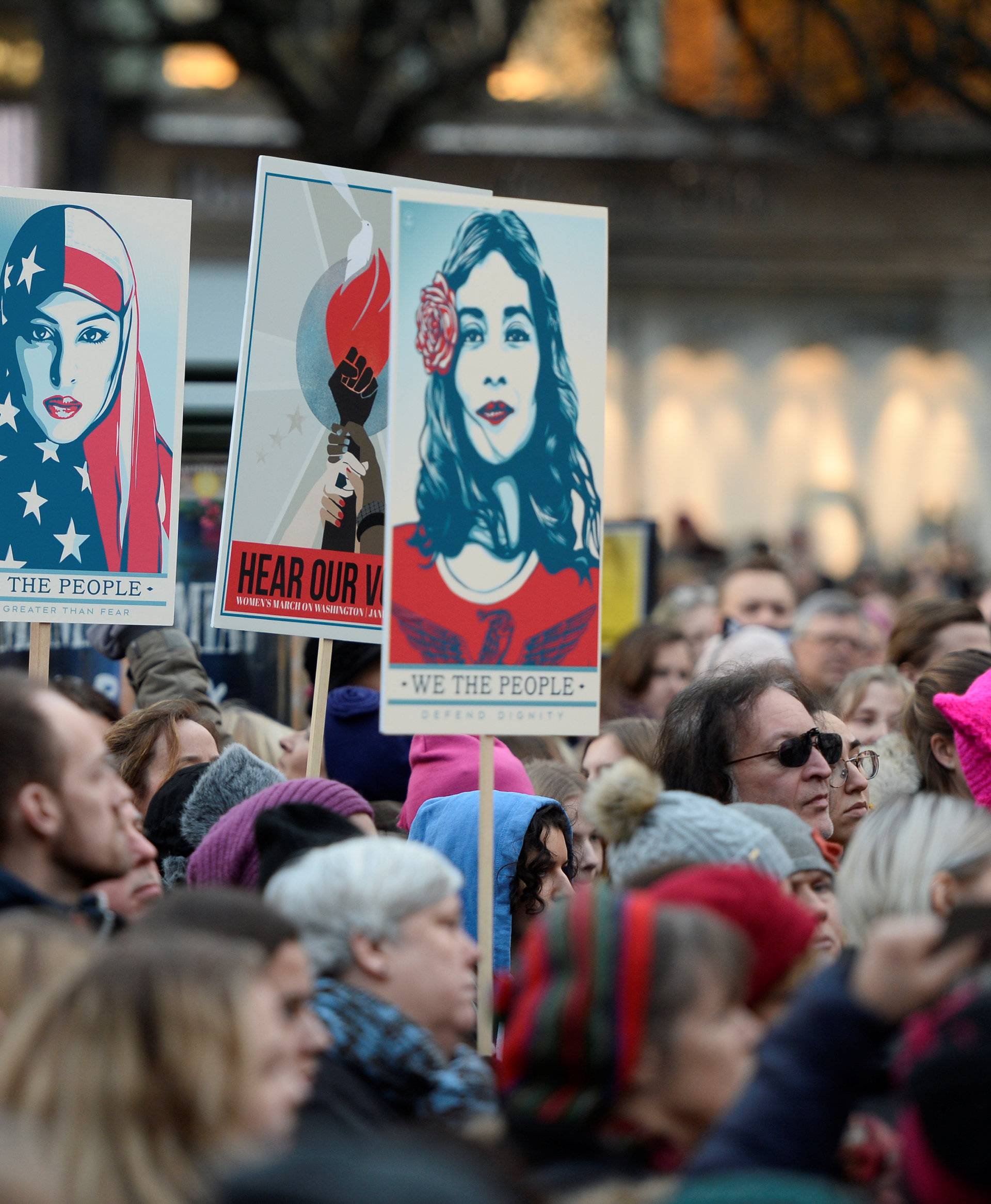 Protesters carrying banners and placards take part in a Women's March in Stockholm, Sweden