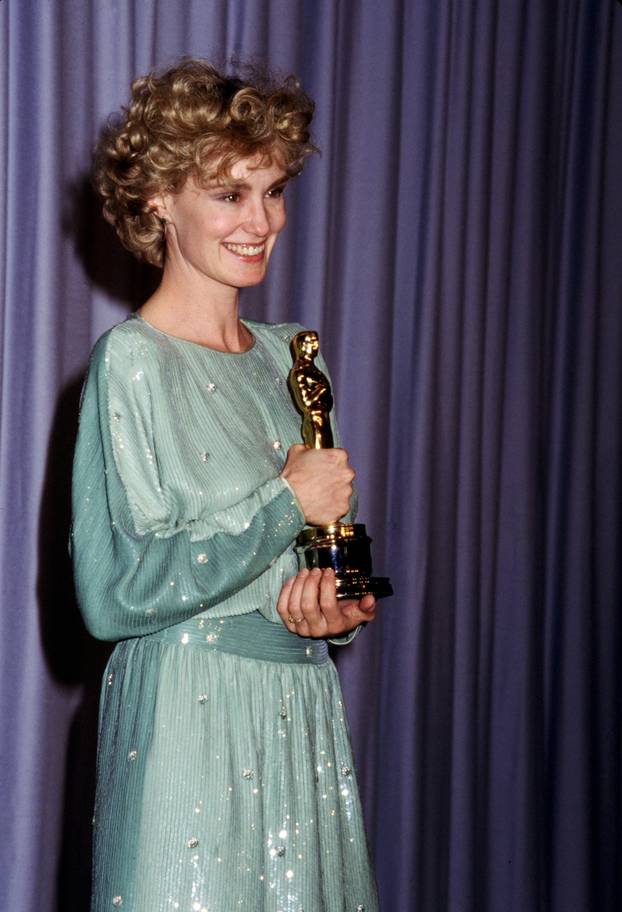 Jessica Lange with her Oscar for "Tootsie" 1983 Academy Awards Shrine Auditorium Los Angeles, CA
