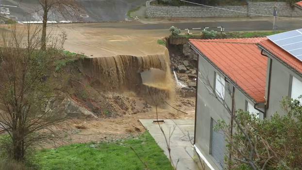 Still image taken from video shows town of Bitti affected by flash floods