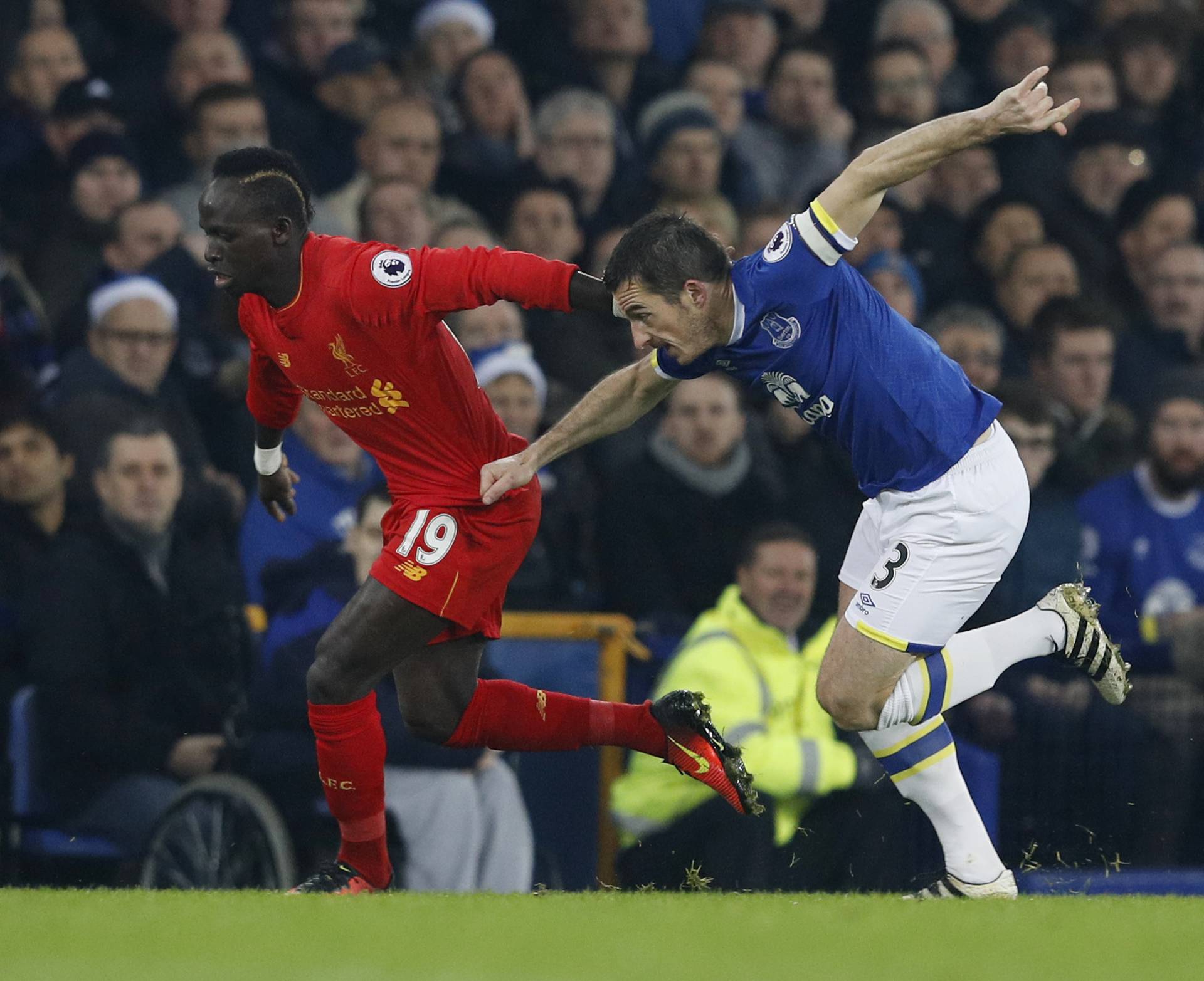 Liverpool's Sadio Mane in action with Everton's Leighton Baines