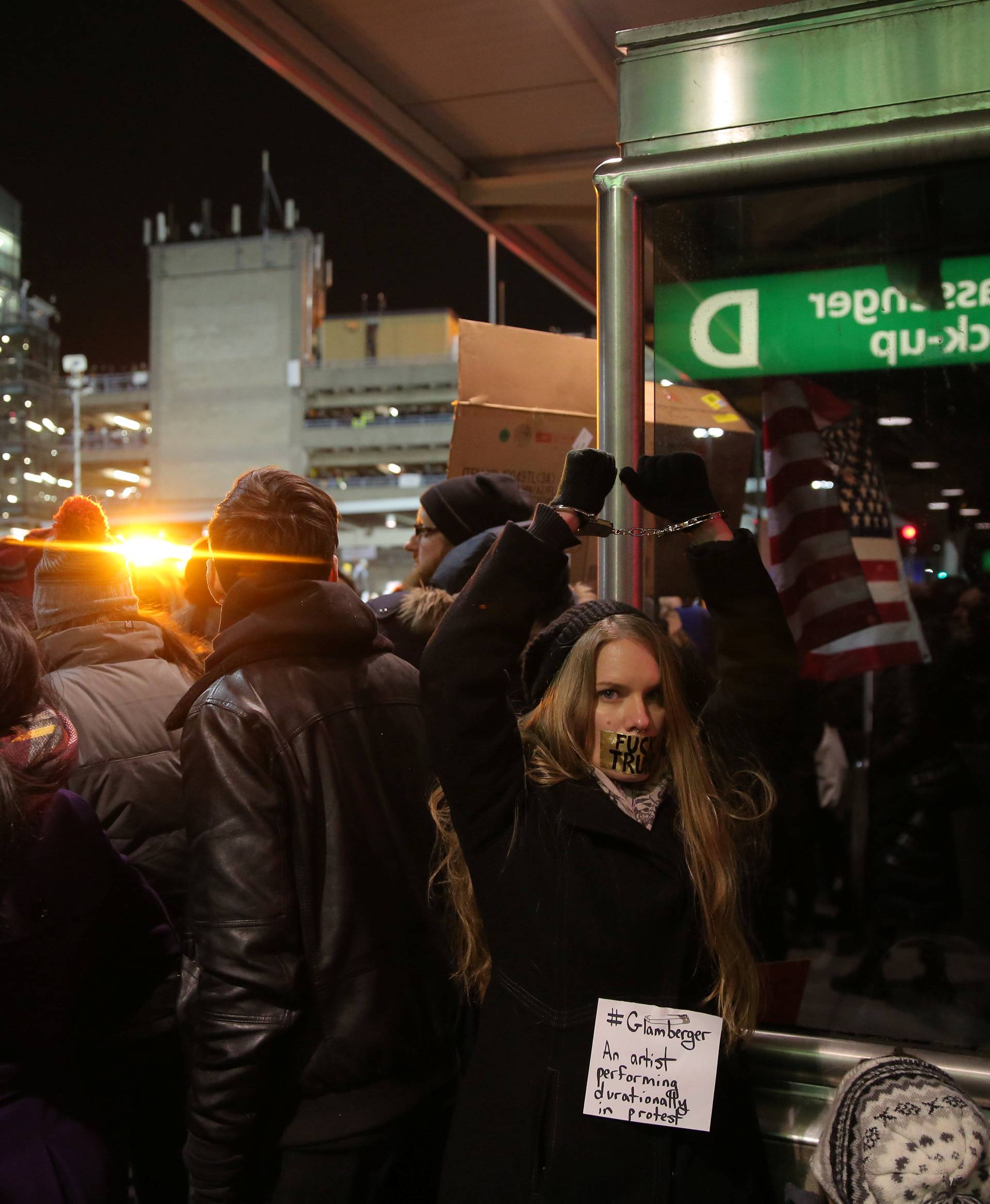 Protesters gather outside Terminal 4 at JFK airport in opposition to U.S. president Donald Trump's proposed ban on immigration in Queens, New York City, U.S.