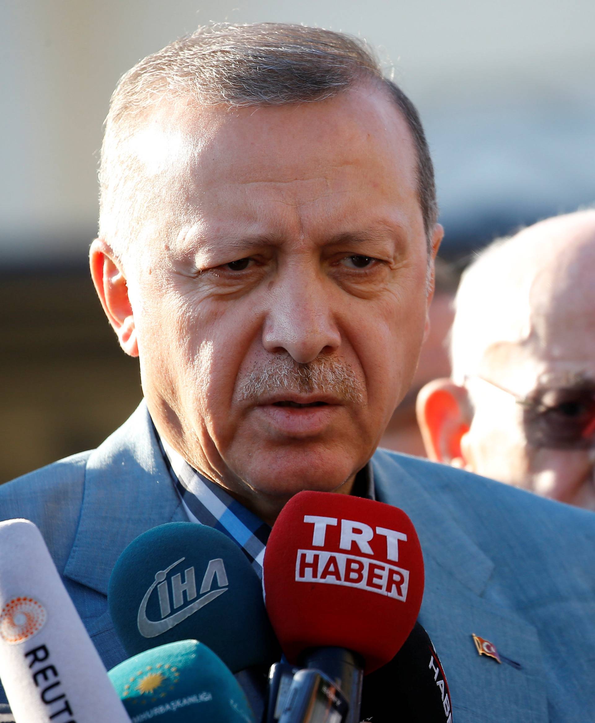 Turkey's President Erdogan talks to media after the Eid al-Fitr prayers in Istanbul