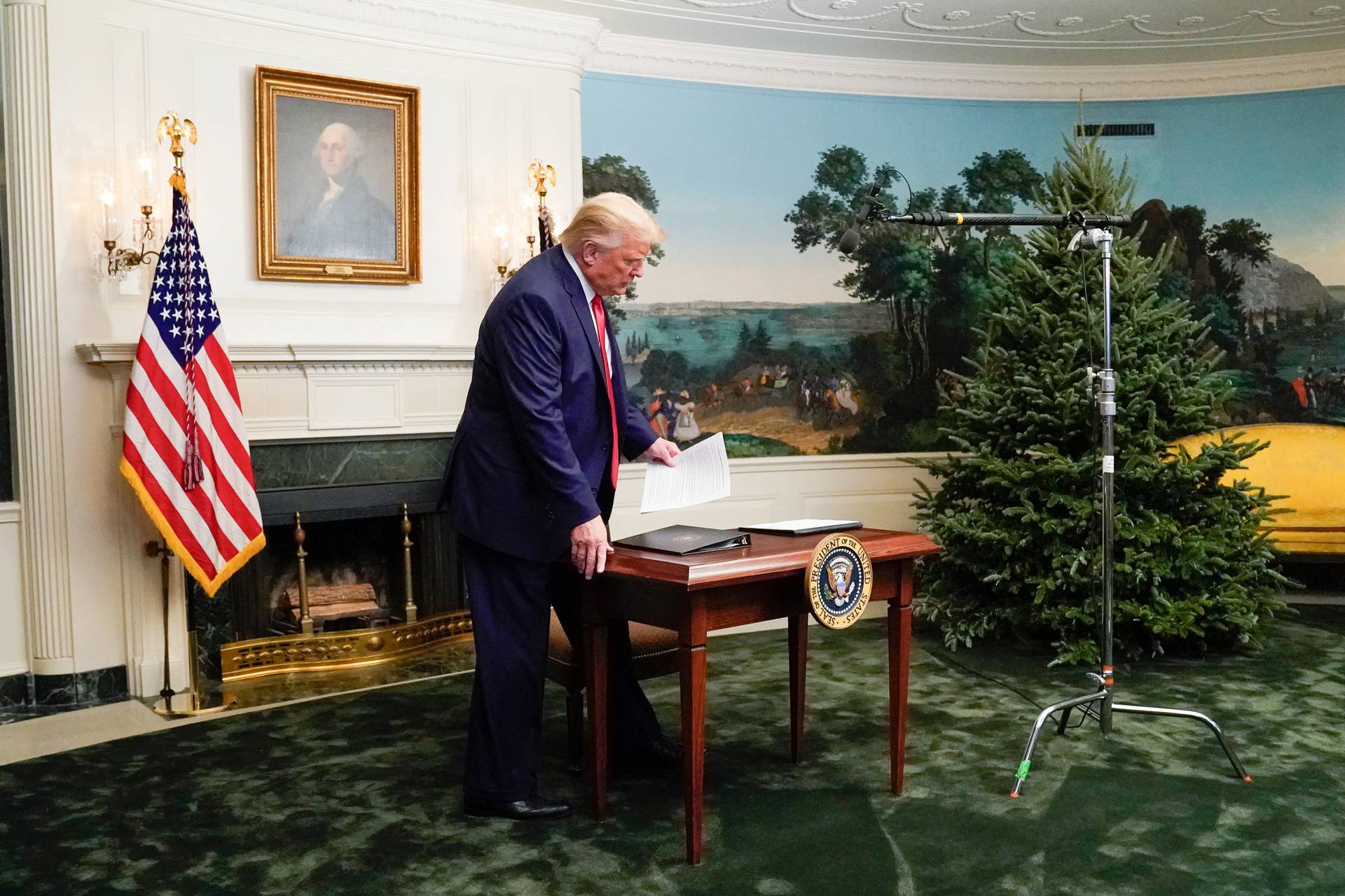 U.S. President Donald Trump arrives to a Thanksgiving video teleconference with members of the military forces at the White House in Washington