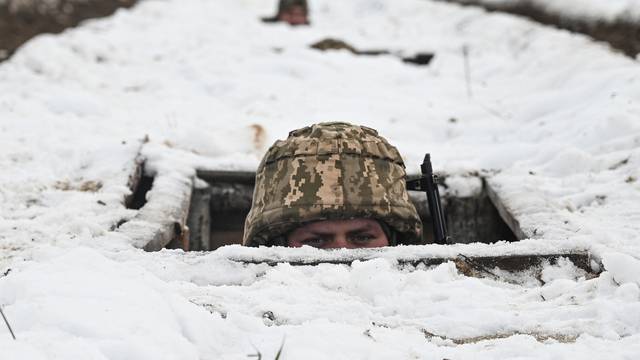 Ukrainian service members attend military exercises in Chernihiv region