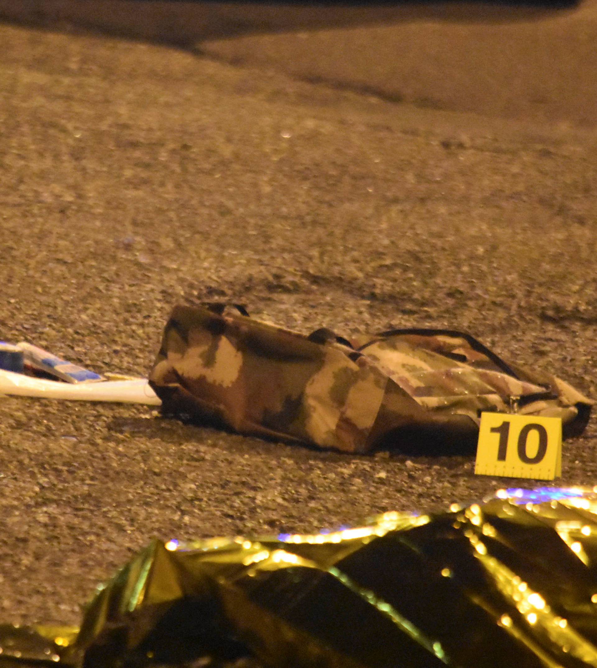 Objects belonging to Anis Amri, the suspect in the Berlin Christmas market truck attack, are seen next to his body in a suburb of the northern Italian city of Milan