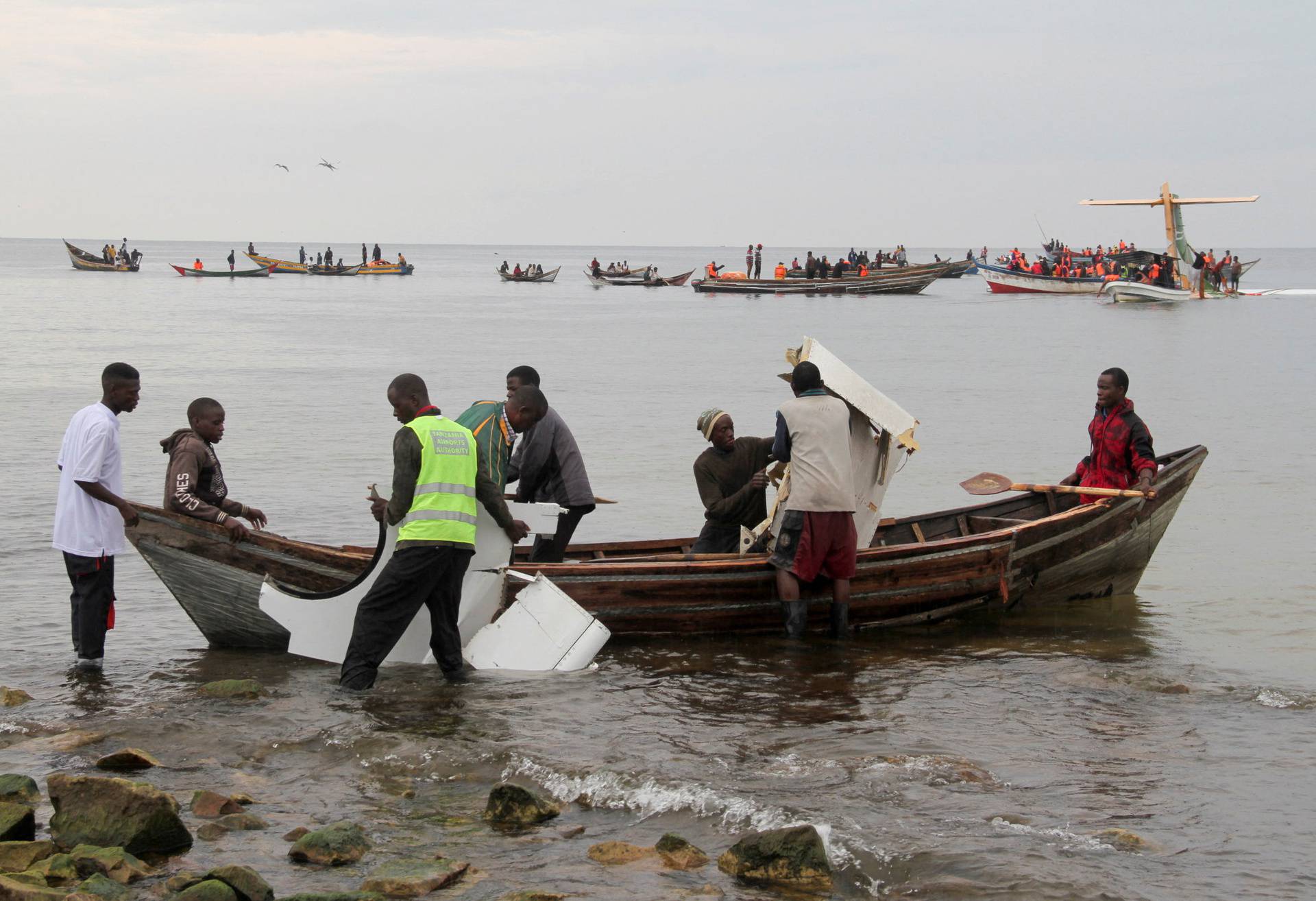 Rescuers attempt to recover the Precision Air passenger plane that crashed into Lake Victoria in Bukoba