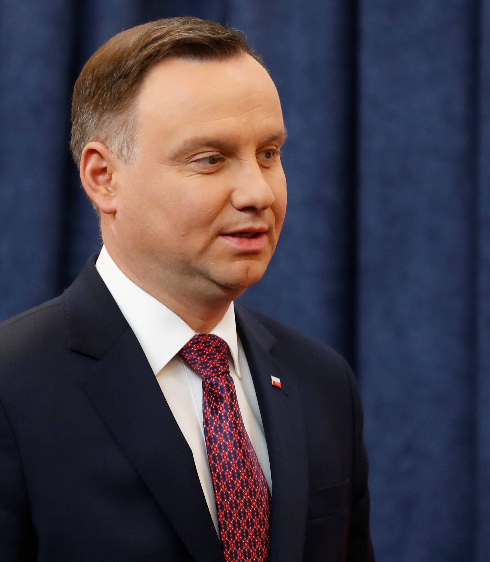 Poland's President Andrzej Duda arrives for a news conference at the Presidential Palace in Warsaw