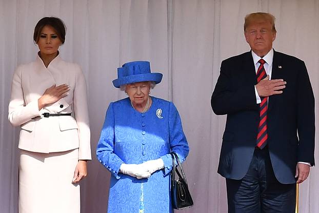U.S. President Donald Trump and First Lady Melania Trump stand with Britain