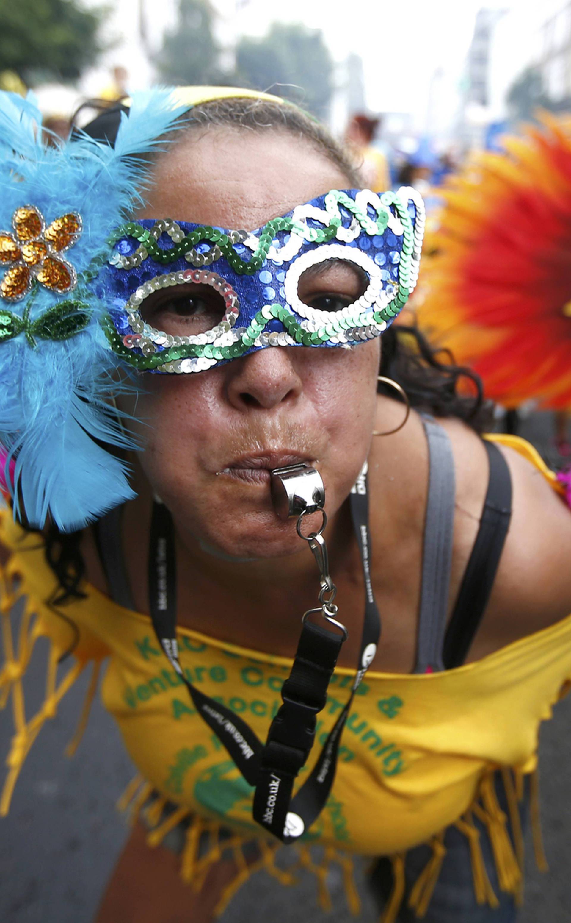 Performers participate in the children's day parade at the Notting Hill Carnival in London