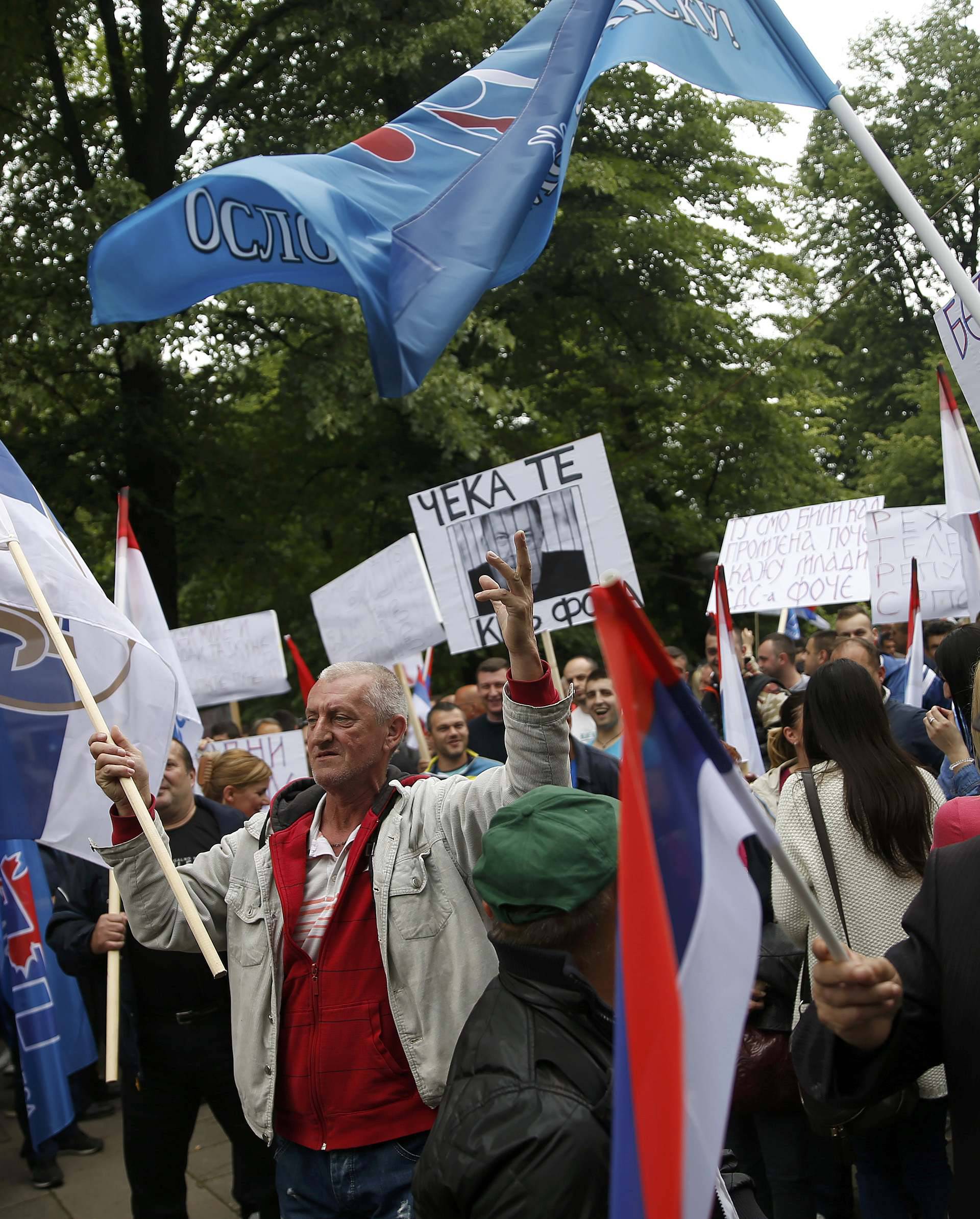 People march during an anti-government protest in Banja Luka