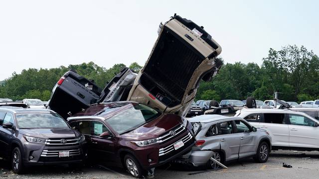 FILE PHOTO: Wrecked vehicles are pictured at a Toyota dealer following a tornado in Jefferson City