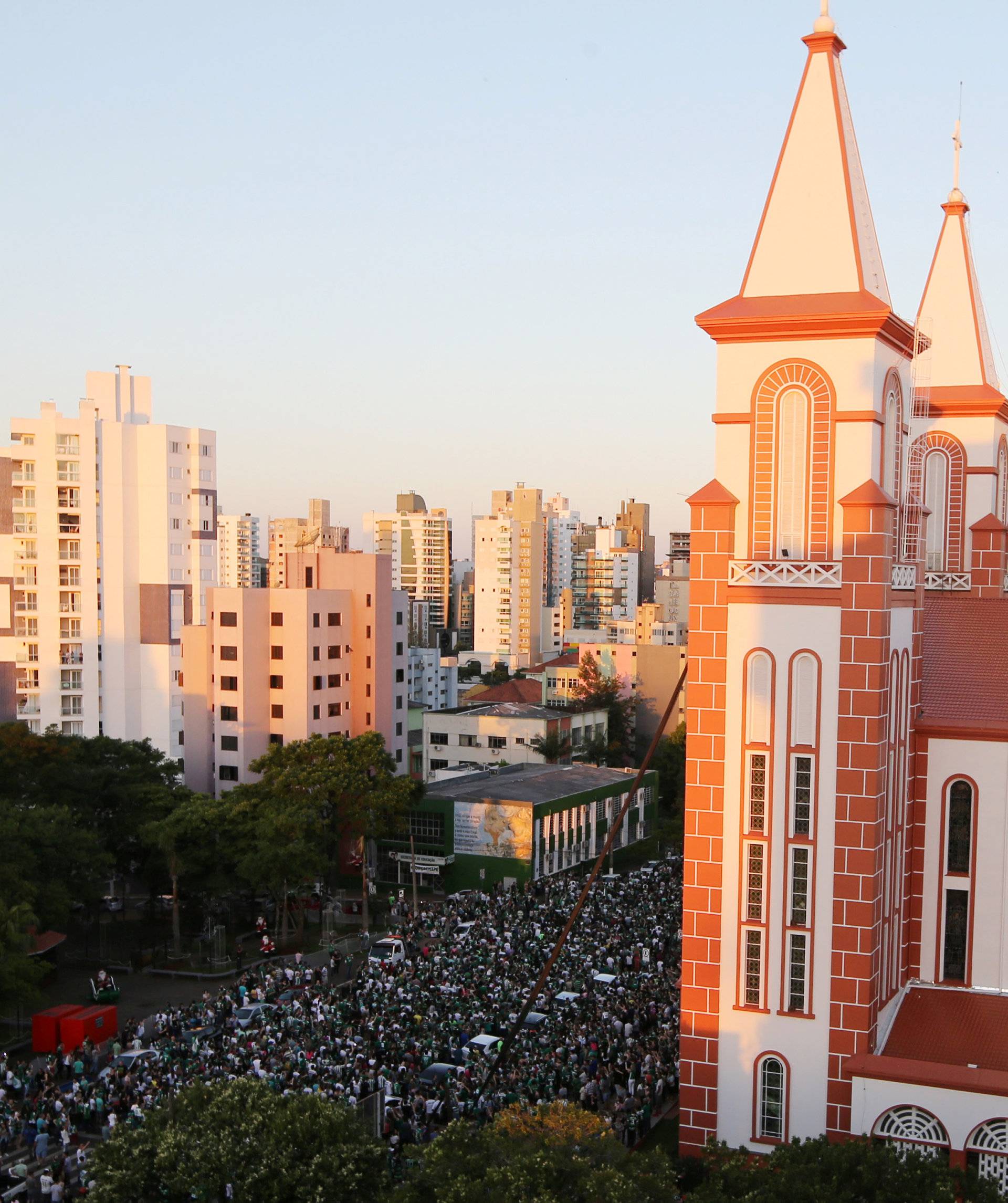 Fans of Chapecoense soccer team gather in the streets to pay tribute to their players in Chapeco