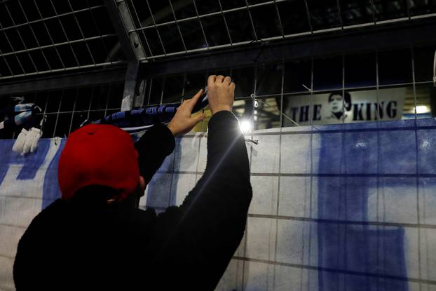 People gather to mourn the death of Argentine soccer legend Diego Maradona, in Naples