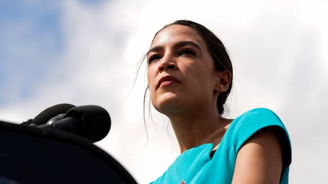 U.S. Representative Alexandria Ocasio-Cortez (D-NY) pauses while speaking during a news conference discussing the introduction of rent legislation outside the U.S. Capitol in Washington