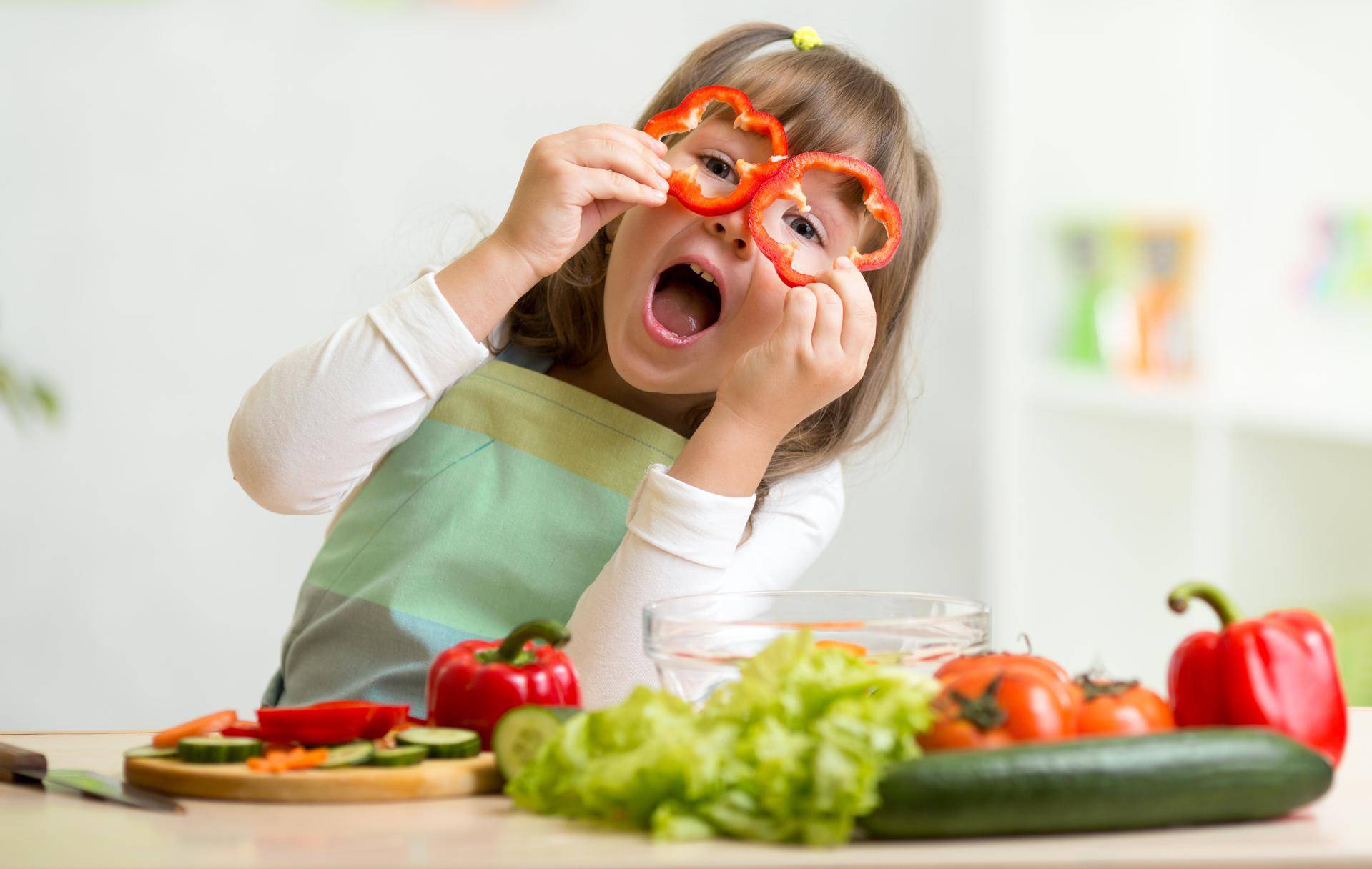 Kid,Girl,Having,Fun,With,Food,Vegetables,At,Kitchen