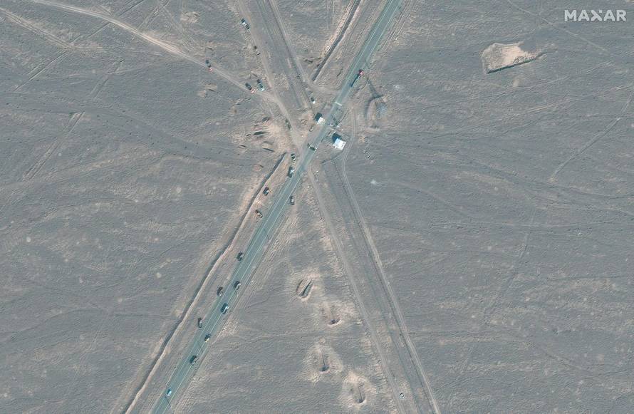 A satellite image shows new vehicle revetments and trucks on the road 1.1 kilometres from the Fordow nuclear facility, near Qom