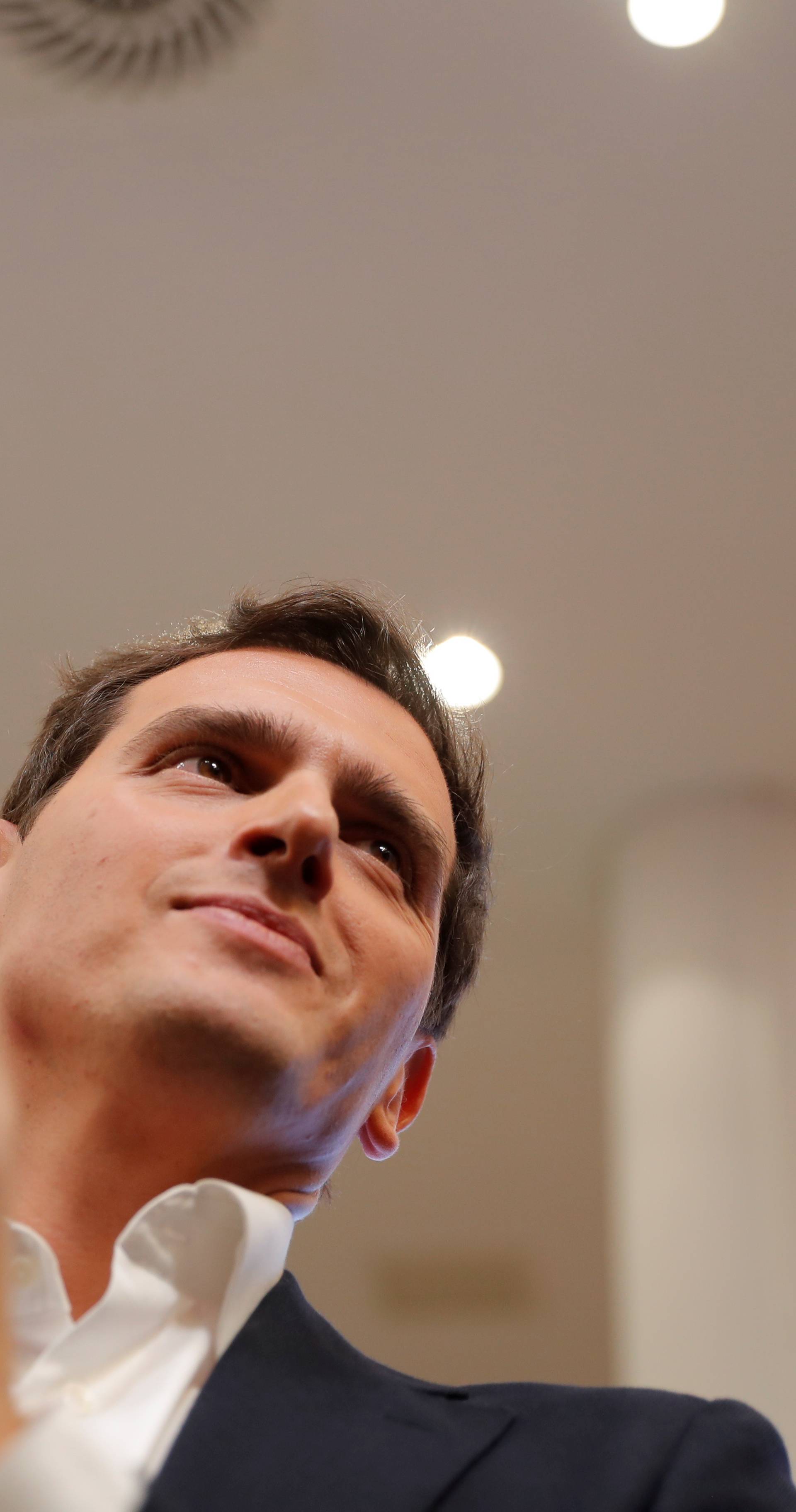 Ciudadanos leader Albert Rivera leaves after announcing his resignation at their headquarters the day after general elections, in Madrid