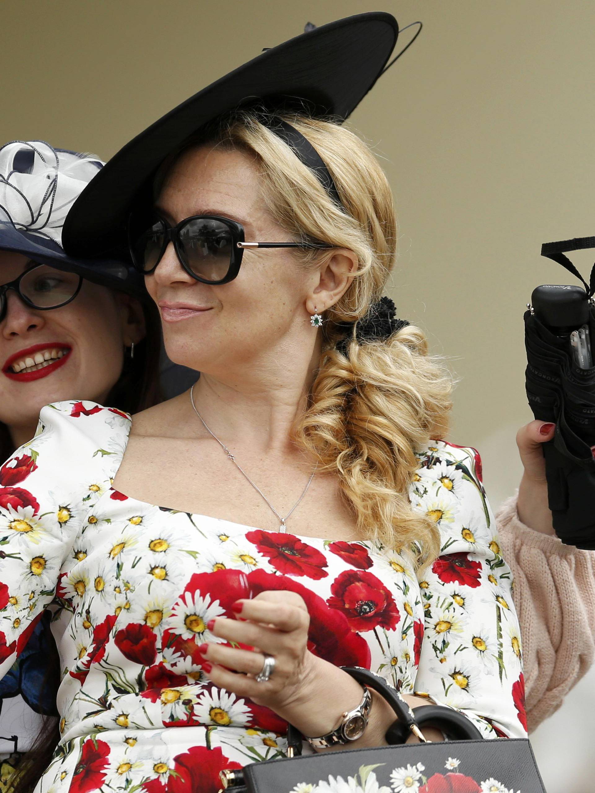 Britain Horse Racing Ladies Day Racegoer wears hat