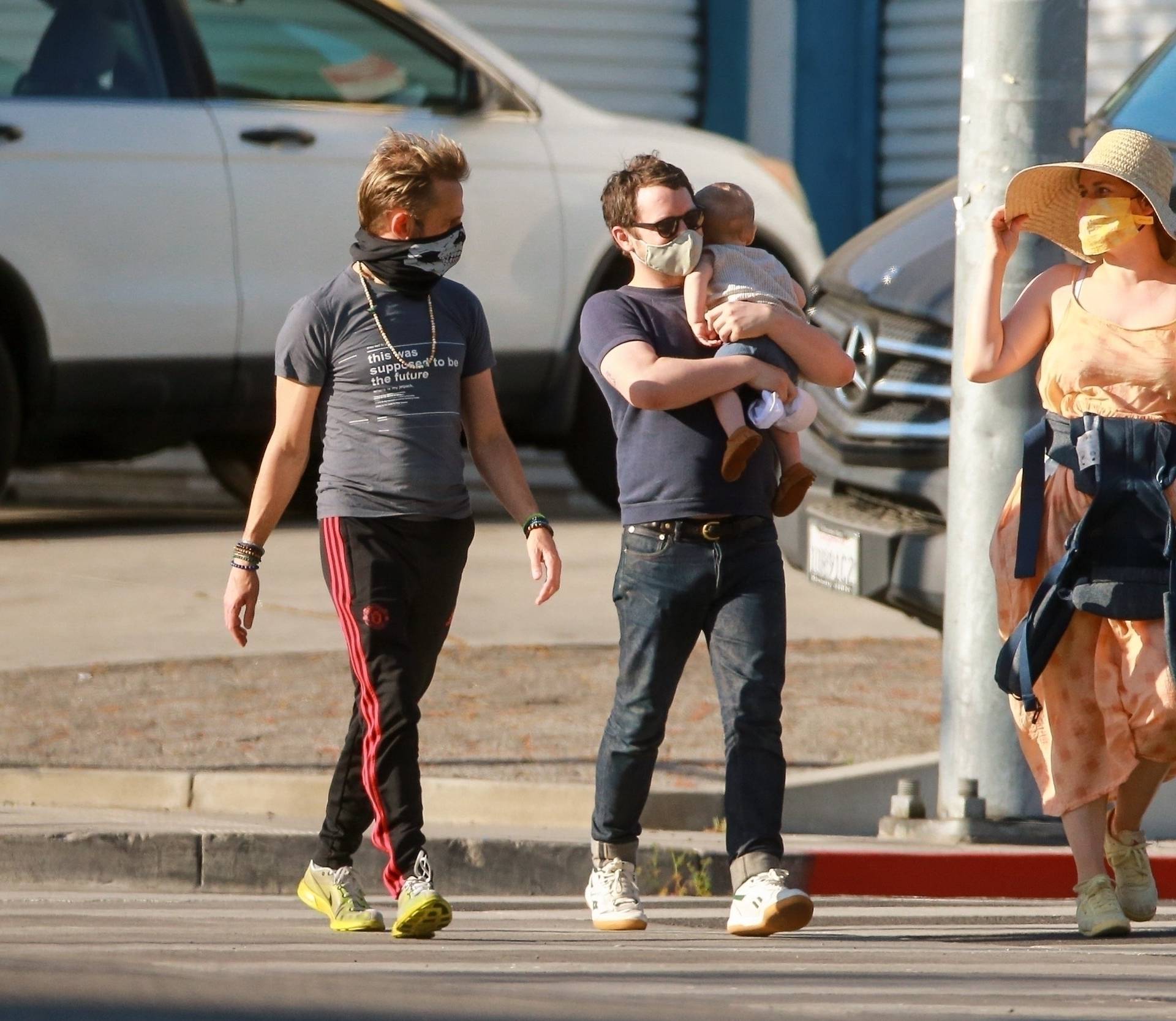 *EXCLUSIVE* Elijah Wood goes for a stroll with his baby and actor pal Dominic Monaghan