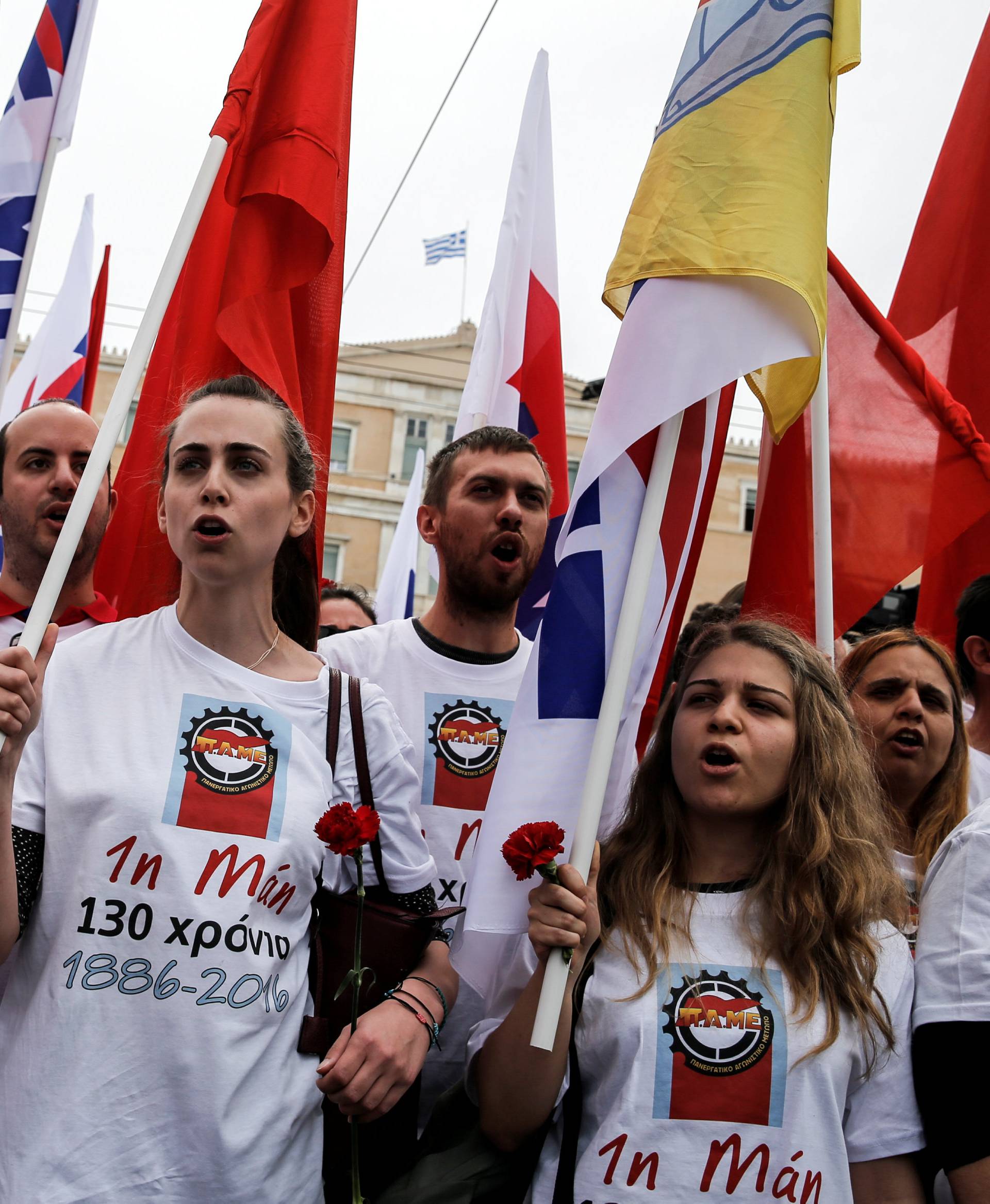 A member of the communist-affiliated PAME shout slogans during a rally commemorating May Day, which was postponed due to the Greek Orthodox Easter, and against tax and pension reforms in Athens