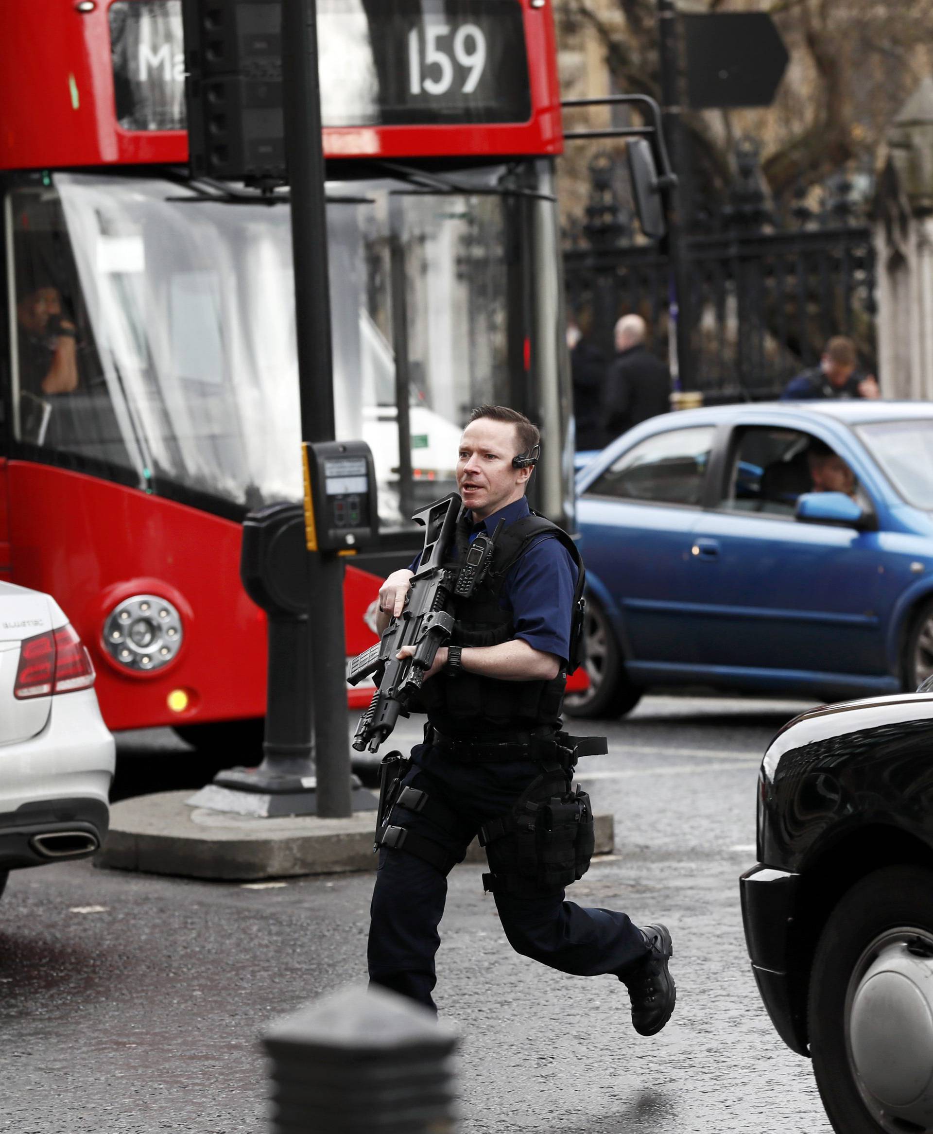 Armed police respond outside Parliament during an incident on Westminster Bridge in London