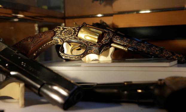 Guns decorated with gold are displayed in the Drugs Museum, used by the military to showcase to soldiers the lifestyles of Mexican drug lords, at the headquarters of the Ministry of Defense in Mexico Cit