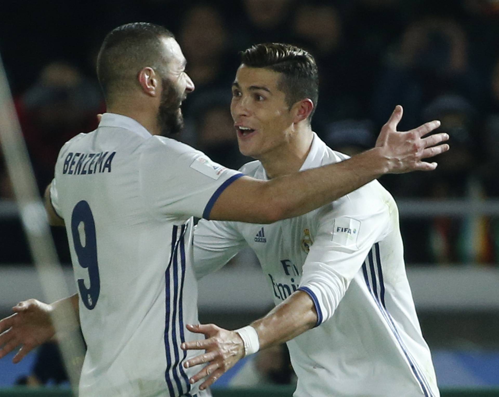 Real Madrid's Cristiano Ronaldo celebrates scoring their third goal with Karim Benzema