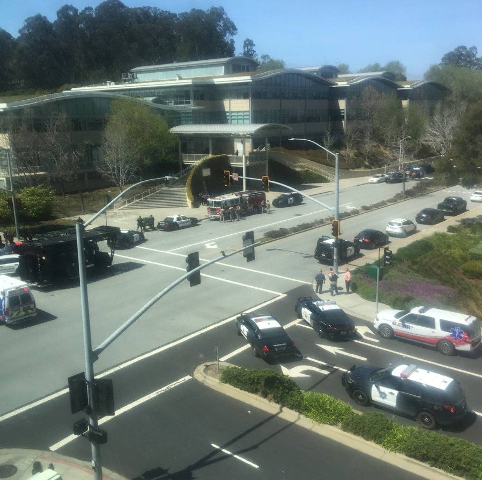 Officials are seen following a shooting at the headquarters of YouTube, in San Bruno, California