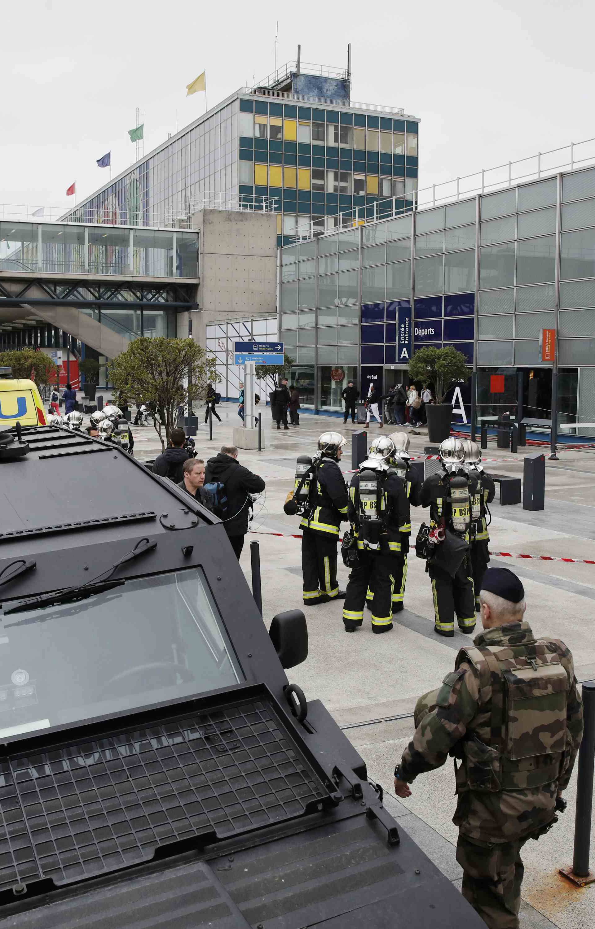 Military and emergency services outside Orly airport southern terminal after shooting incident near Paris