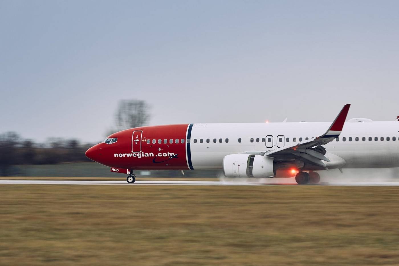 Prague, Czech Republic - December 11, 2018: Norwegian Boeing 737-800 during landing in rain at Prague Airport on December 11, 2018.