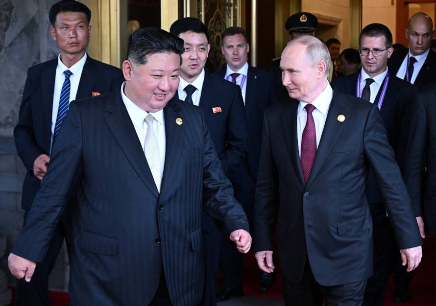 Russian President Vladimir Putin meets with North Korean leader Kim Jong Un in Beijing